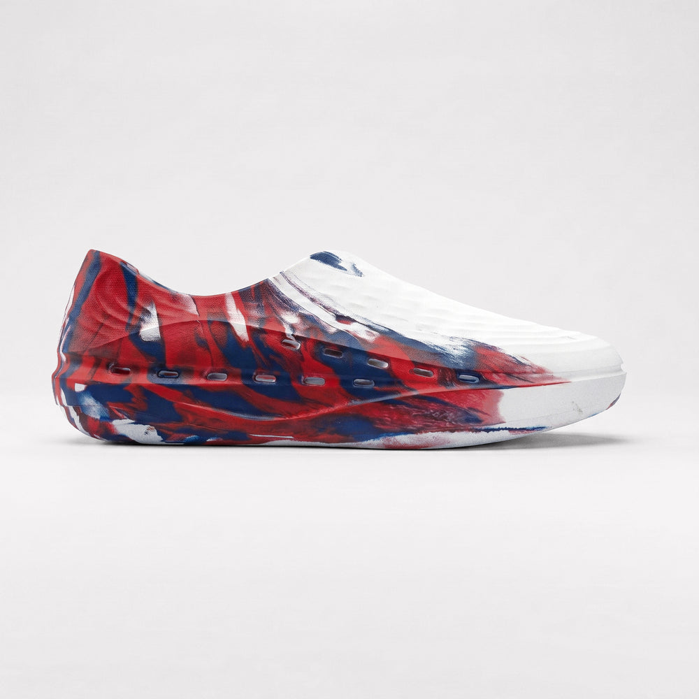 Red, white, and blue slip-on shoe on a light gray background